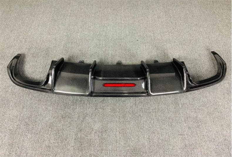 Audi A5/S5 Karbel Style Carbon Fibre Rear Bumper Diffuser - Inspired by Karbels design with the incorporated centre LED racing brake light for added flair. We think this is the most aggressive rear diffuser you can fit into your Audi A5/S5 B8.5 Model. Manufactured from Real Carbon fibre and FRP to give it a structure that will stand the test of time and speed.  