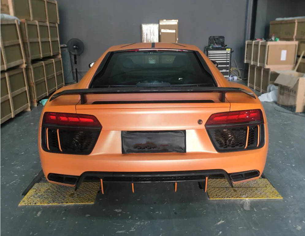 Audi R8 Carbon Fibre Rear Spoiler - Manufactured to enhance the look and drivability of the Audi R8, this Rear Spoiler wing attaches to the R8 with 4 securing bolts to ensure its stability at speed and to also transfer the downforce through to the back wheels to keep them planted in corners. 