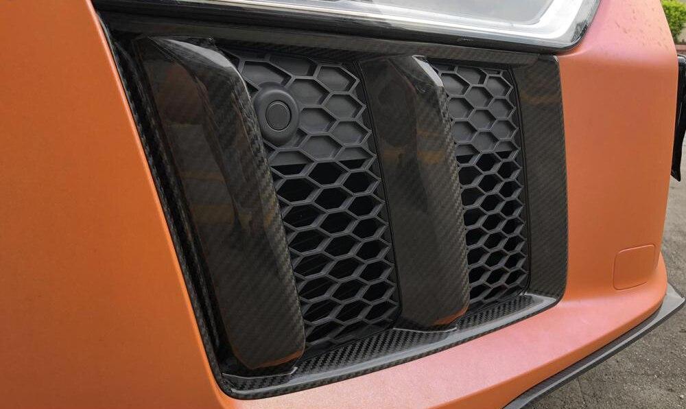 AUDI R8 V10 Carbon Fibre Front Bumper Canards - Styled from the stunning design of the Audi R8's front bumper, this product is a must-have if you're looking to add a touch of flair to your Audi R8. You know what they say. The devils in detail and these 100% Carbon fibre front canards have the detail you are looking for. 