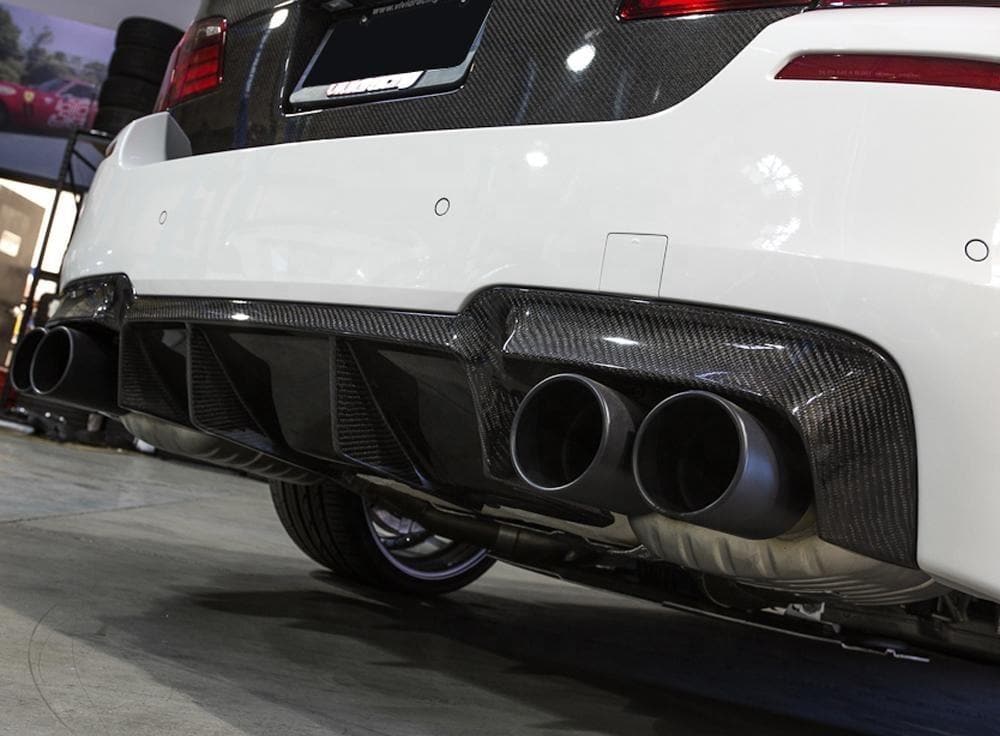 BMW F10 M5 Vorsetiner Style Carbon Fibre Rear Bumper Diffuser - Created with the Vorsteiner Style that has an aggressive stance to really improve the rear end on your M5 and bring it more of a presence when stood and rolling on the road. 