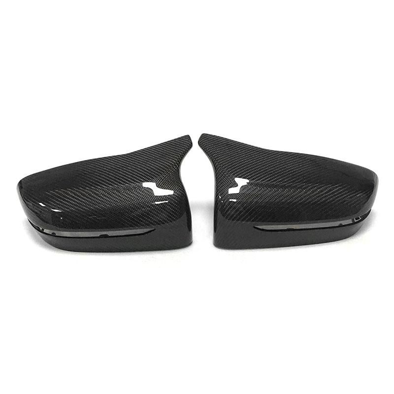 BMW 2 Series (G42) M Style Carbon Fibre Replacement Mirror Covers - Manufactured from Real Carbon Fibre with an ABS Plastic base to ensure this product's fitment is perfect for your G42 2 Series BMW Model. Taking inspiration from the M Styling, this product has a modified solid top point section to meet the door without impeding the mirror folding capability. 