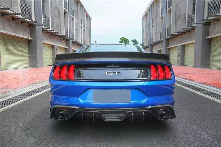 Ford Mustang 6th Generation GT Style Carbon fibre Rear Diffuser - Inspired by the GT styling with a full exhaust surround rear diffuser with the upswept carbon fibre rear canards on each side of the bumper to add extra aggression to the rear of your Mustang. Manufactured from 2*2 carbon fibre weave with FRP to provide a durable and robust product that will look amazing from day 1. 