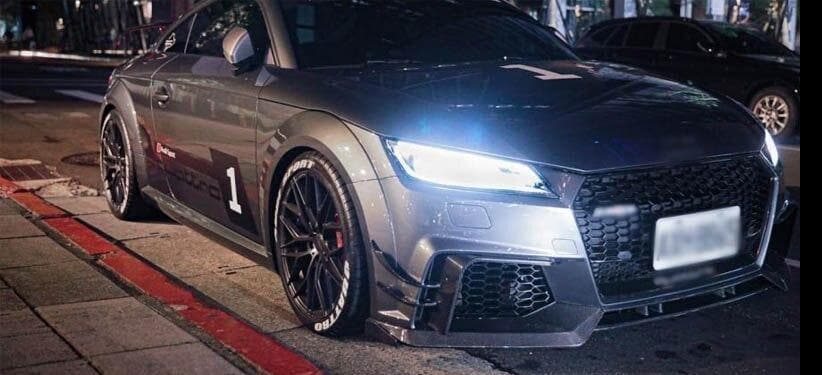 Audi TTRS Mk3 8S Model Night Time Photo With Head Lights On. Folded Wing Mirror Covers. Carbon Fibre Front Lip Spoiler Audi TTRS. Audi TTRS Gloss Black Front Grille. Audi TTRS Carbon Fibre Front Decoration Canards. Carbon Fibre Front Wind Knifes.