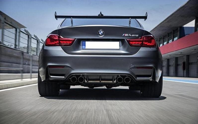 BMW Motorsport GTS Rear Spoiler Wing fitted to an M4 GTS Model with OLED Rear Tail Lights on a race track going fast