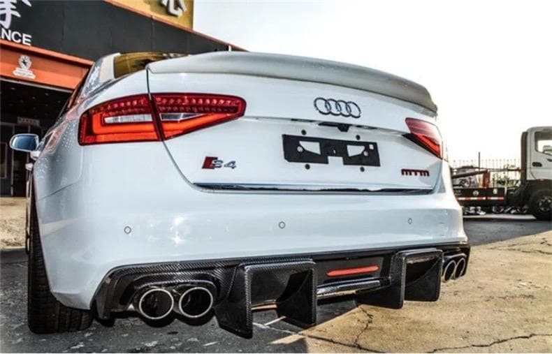 Audi-B8.5-S4-Carbon-Fibre K-Style-Rear-Bumper-Diffuser-(2013 - 2016).jpgAudi B8.5 A4/S4 KB Style Carbon fibre Rear Diffuser for the A4 S Line, S4 and Non-S Line A4 Models between 2013 - 2016. This diffuser is inspired by Karbels design with the integrated LED centre rear brake light used as either a race-style brake light or a 2nd Fog light. Manufactured from Real Carbon fibre and FRP to create a strong and durable product that will last the lifetime of your Audi A4 Model. 