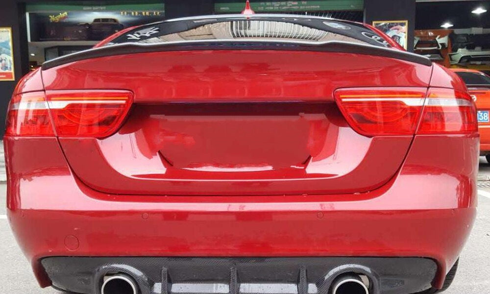 Jaguar XE V Style Carbon Fibre Rear Trunk Spoiler - Inspired by the Vorsteiner Styling and modified to be a perfect fit for the Jaguar XE Models. This product has a slight cut out in the centre section to add a unique style to the Jaguar XE Model. Manufactured from 2*2 Carbon Fibre Weave with FRP. 