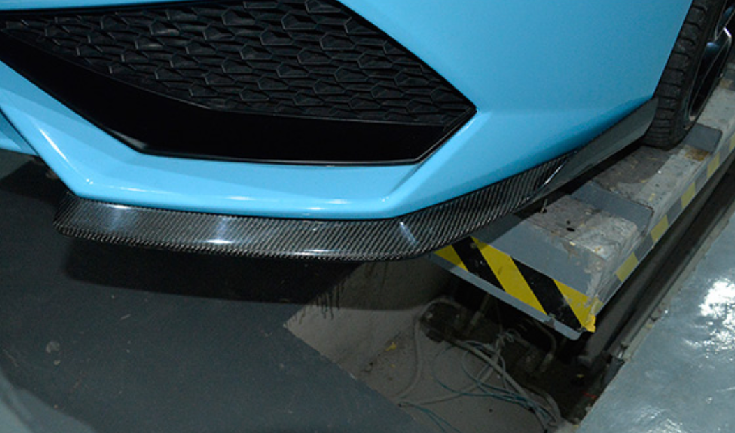 The Lamborghini Huracan LP610-4 Coupe/Spyder Carbon Fibre Front Bumper Lip Splitters  The Lamborghini Huracan LP610-4 Carbon Fibre Front Bumper Lip Splitters are designed using 3D Scanning of the original bodywork to ensure we create this product to fit perfectly to your Huracan. Manufactured from 2*2 Carbon Fibre Weave finished in a UV Resistant Gloss Resin to create an unrivalled look on your Huracan Coupe/Spyder. 