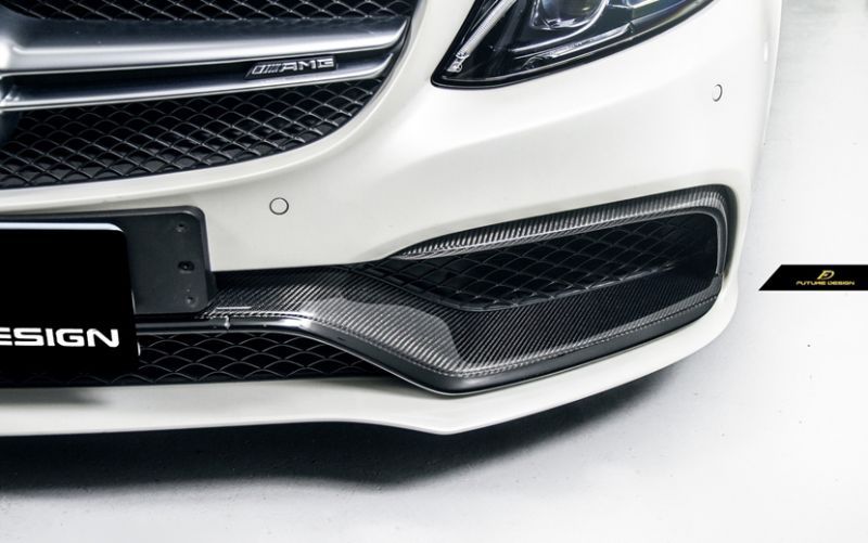 The Future Design Mercedes Benz C63 and C63S Carbon Fibre Front Trim Replacement - Not only does this add a dark, menacing tone to the nose of your W205 C63 Saloon/ S205 C63 Estate/ C205 C63 Coupe, but the pop of carbon fibre weave gleaming in the light will be sure to turn heads. The front fascia gets the flare it deserves without compromising the class and sophistication that a vehicle of this calibre possesses. 