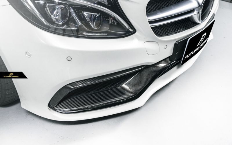 The Future Design Mercedes Benz C63 and C63S Carbon Fibre Front Trim Replacement - Not only does this add a dark, menacing tone to the nose of your W205 C63 Saloon/ S205 C63 Estate/ C205 C63 Coupe, but the pop of carbon fibre weave gleaming in the light will be sure to turn heads. The front fascia gets the flare it deserves without compromising the class and sophistication that a vehicle of this calibre possesses. 