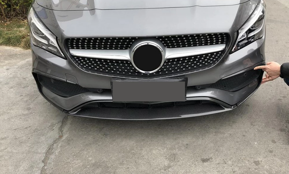 Mercedes Benz CLA-Class/CLA45 Facelift Carbon Fibre Front Bumper Insert with Front Fog Light Surround Canards - Manufactured from 2*2 Carbon Fibre weave with FRP to produce a robust and durable product that will add aggression and style to the front of your AMG Line Mercedes CLA Class Model. 