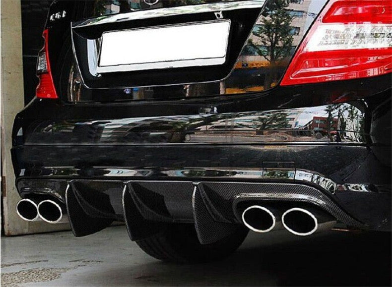 Mercedes Benz C-Class/C63 (C204/W204) Saloon and Coupe Big Fin Style Carbon Fibre Rear Diffuser - inspired by the original C63 diffuser and modified with additional larger fins which screw onto the diffuser from the backside to produce a more aggressive look on your C63 Coupe or Saloon Model. This product is manufactured from 2*2 Carbon Fibre with FRP, giving this product strength and durability on the road. 