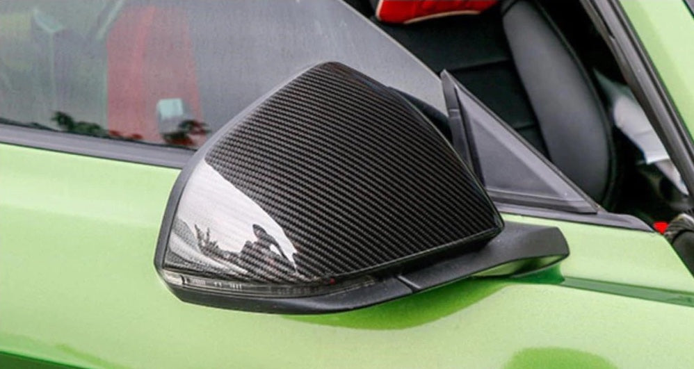 The Ford Mustang 6th Generation Pre Facelift (Pre 2018) Add-On Style Carbon Fibre Mirror Covers With or Without the indicator cutout - Manufactured from 2*2 Carbon Fibre Weave and handcrafted by our expert carbon fibre manufacturers. This product adds style to the already stunning Mustang, transforming your body coloured mirror covers to the 2*2 Carbon Fibre weave styling. 