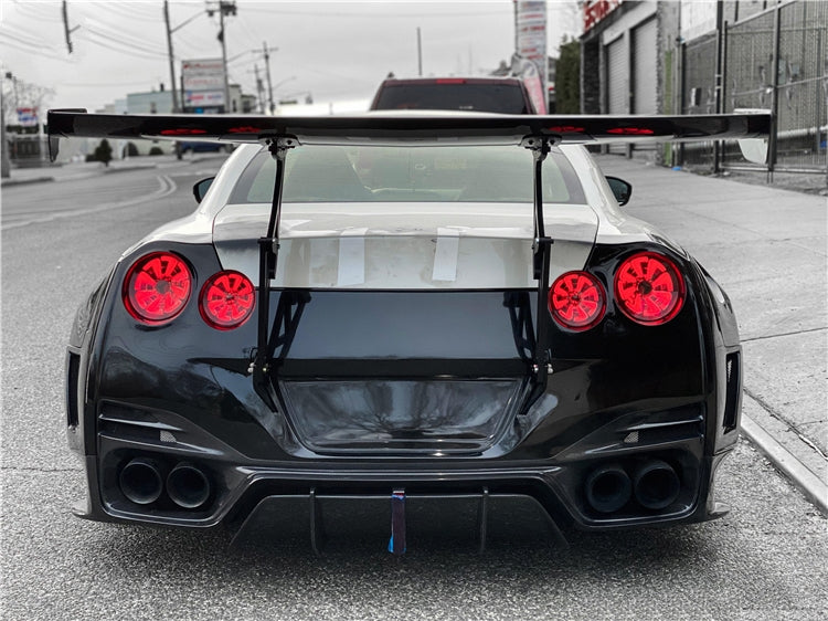 The Nissan GTR R35 Pre-Facelift BSP Style Carbon Fibre Rear Wing Spoiler - Featuring the most outlandish styling that you can add to your Nissan GTR with this BSP Rear Wing Setup. This product attaches to the rear bumper of the Nissan GTR Model with Alloy Mounting Brackets. This Spoiler is the preferred choice for those track GTR Models. 