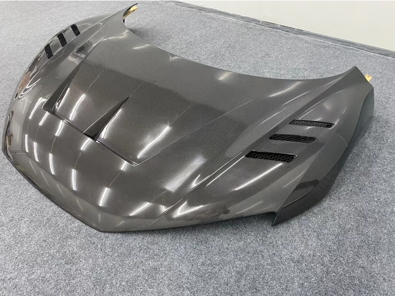 Audi R8 V10 Type 4S Carbon Fibre Replacement Hood - Manufactured from either FRP and 2*2 Carbon Fibre or FRP and Carbon Fibre, This product replaces the original hood on your Audi R8 V10 with the Aggressive looking Carbon Fibre version with integrated Hood vents and centre dipped formation, giving the Audi R8 a new look completely. 