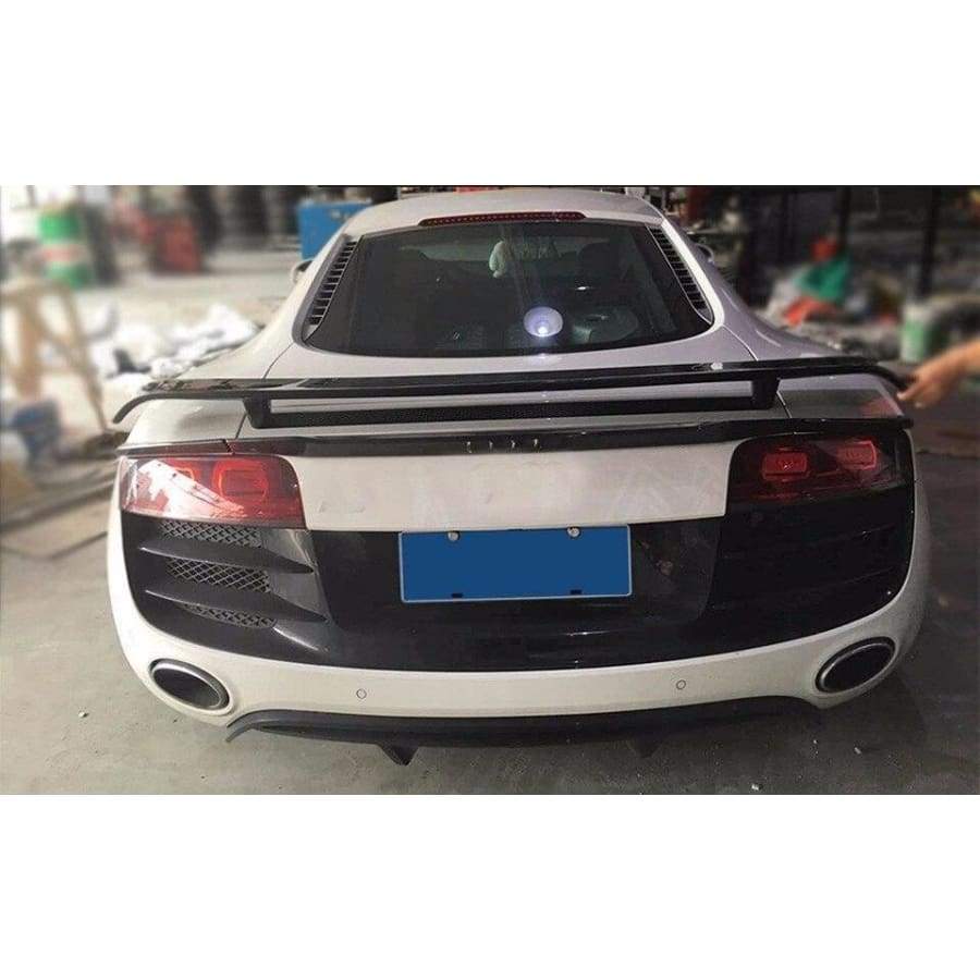 Audi R8 Carbon Fibre Rear Spoiler - Manufactured to enhance the look and drivability of the Audi R8 this Rear Spoiler wing attaches to the R8 with 4 securing bolts to ensure is stability at speed and to also transfer the downforce through to the back wheels to keep them planted in corners. 