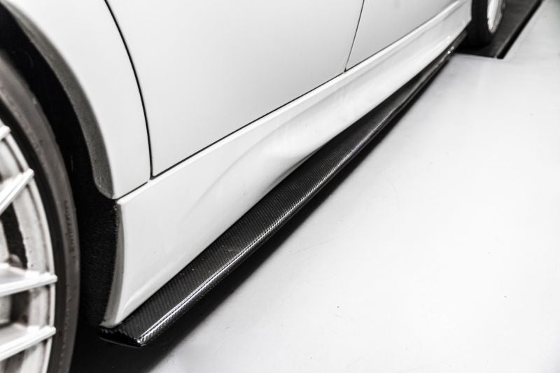 BMW E9X 3 Series M Performance Style Carbon Fibre Side Skirt Extensions - Manufactured to fit the E90 Saloon, E91 Estate, E92 Coupe and E93 Convertible Models. This product is attached with either fixing screws or bonds to create a stunning addition to the side of your M Sport Model BMW. You are enhancing the side view while providing aerodynamic downforce. 