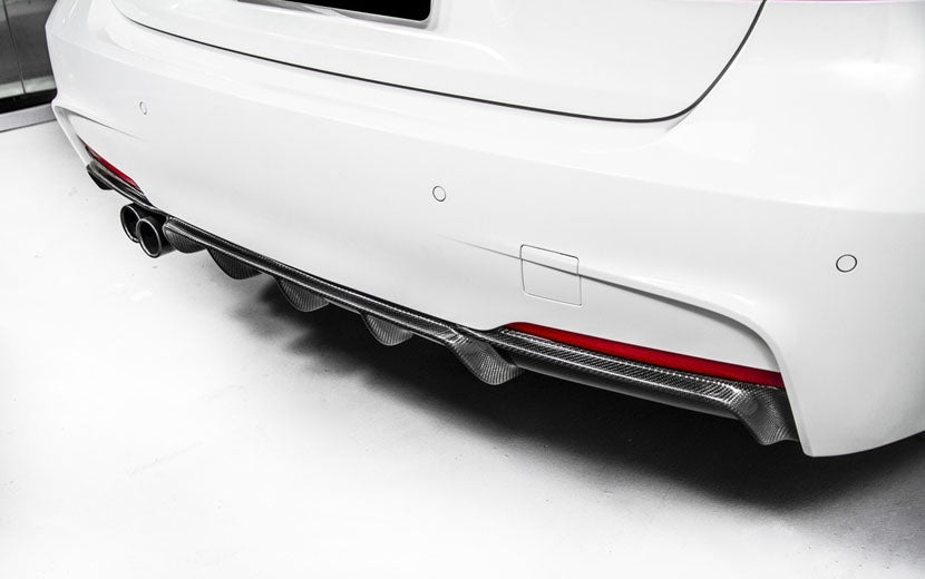The BMW F30/F31 Saloon/Estate 3 Series Twin Exhaust Rear Diffuser is Made of carbon fibre material Composite with FRP for the best fitment possible.  Its Racing inspired aerodynamics and styling fit BMW 3 series F30 sport edition 320i 325i 328i 335i M sport M-tech. M Tech Single Rear Diffuser is Super lightweight and Durable. It is UV-Protective Clear Coated or Fade & Rust Resistant.