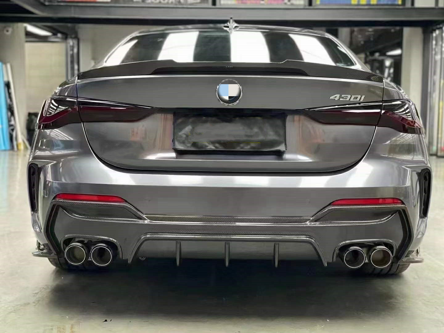 BMW 4 Series G22/G23 M Performance Style Carbon Fibre Quad Exhaust Rear Diffuser - Manufactured from 2*2 Carbon Fibre and styling is taken from the OEM Manufacturers of BMW Performance. This rear diffuser perfectly adds to the stunning design of the new BMW 4 Series G22/G23 Coupe/Convertible Models. Fixed in place with Fixing Screws and adding the M Performance Styling to your G Series 4 Series BMW. for use on models changing their OEM exhaust systems to a quad system outlet