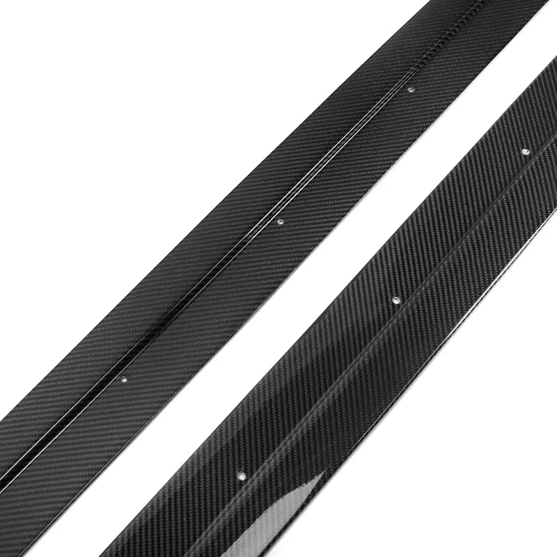 Upgrade the look of your BMW F87 M2 with these Full Length M Performance Style Carbon Fibre Side Skirts. These side skirts are designed to give your vehicle a more aggressive and sporty appearance. They are manufactured using high-quality carbon fibre and FRP, creating a strong and durable product. The skirts are coated with a UV-resistant resin to prevent fading or discoloration. The precision moulds used to create these side skirts are based on OEM parts, ensuring a perfect fit for your vehicle.