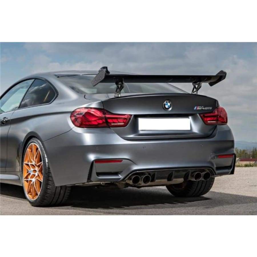 BMW Motorsport Rear Wing Spoiler in Carbon Fibre Fitted to an M4 GTS Model with Orange Competition Wheels. OLED Rear Tail Lights Tinted Rear Windows M4 M4 GTS Model. 