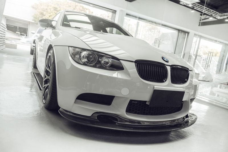BMW M3 GT4 Style Carbon Fibre Front Lip Spoiler for the E90 Saloon, E92 Coupe and E93 Convertible Models - Manufactured from 2*2 Carbon Fibre weave and designed in the GT4 Styling for the BMW M3 Models, this product enhances the front aerodynamics while also adding more aggression to this already aggressive model. 