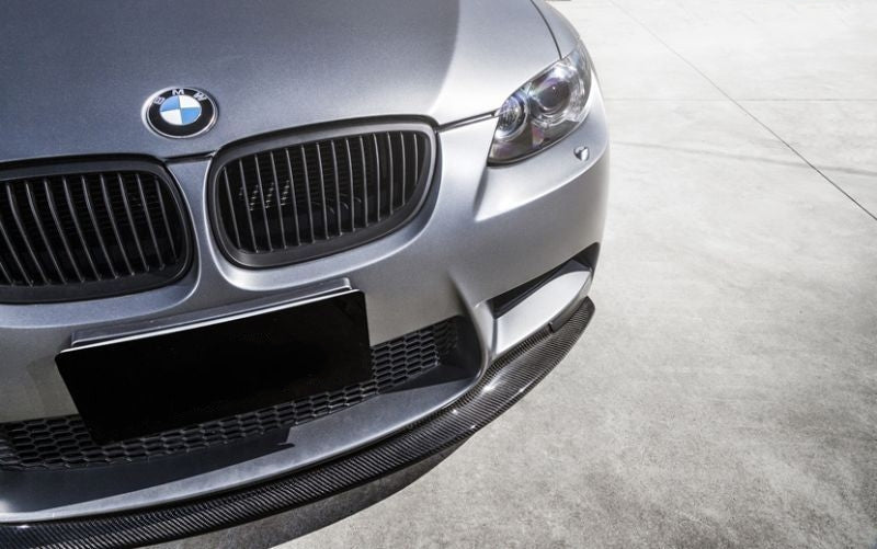 BMW M3 E9X GTS Style Carbon Fibre Front Lip Spoiler - Manufactured from 2*2 Carbon Fibre Weave with FRP to produce a robust and durable front lip spoiler for the E90 Saloon E92 Coupe and E93 Convertible M3 Models. This product fits perfectly into the recesses on the front bumper of the E9X M3 BMW and extends outwards, adding better aerodynamics while also transforming the look of this stunning future classic. 
