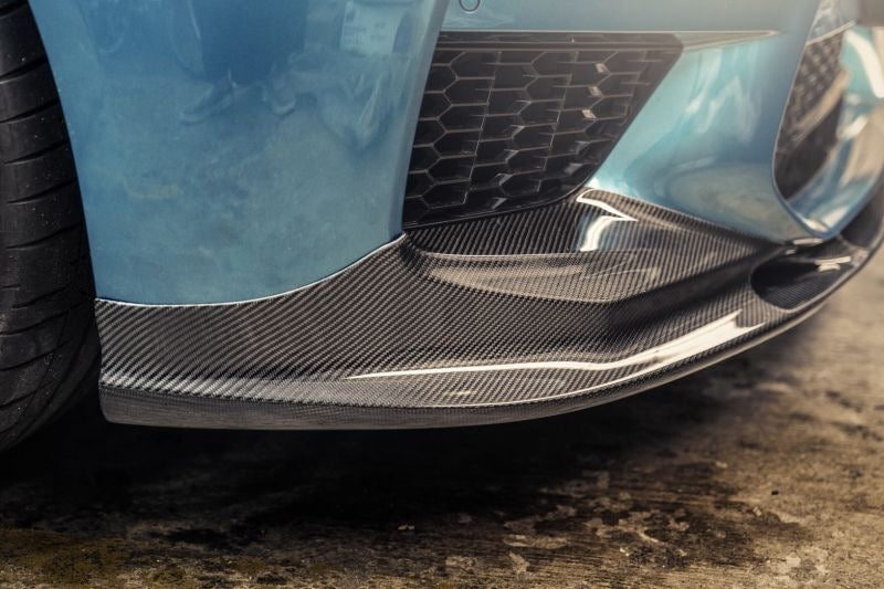 Give your BMW M5 a sporty and aggressive look with this high-quality carbon fibre front lip spoiler. Designed to fit the F90 M5 pre-facelift models from 2018 to 2020, this spoiler is inspired by the M Performance line and made from CFRP for durability and lightness. Order now and enhance the appearance and aerodynamics of your M5.