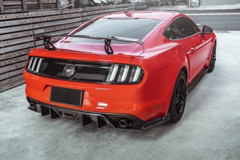 Upgrade the style of your Ford Mustang with the GTS-V Style Carbon Fibre Rear Wing Spoiler. Designed to replicate the Vorsteiner GTS-V spoiler, this product is made from strong and durable CFRP with a glossy carbon finish. Includes black aluminium uprights for a secure fit on 2015-2023 models. Give your car an aggressive and sporty look with this high-quality rear wing spoiler.