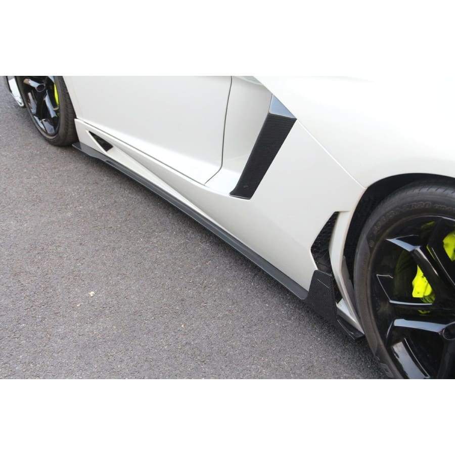 The Lamborghini Aventador LP700 and LP700-4 Roadster Carbon Fibre Side Skirt Extensions.  The Lamborghini Aventador LP700 Carbon Fibre Side Skirts are designed using 3D Scanning of the original bodywork to ensure we create this product to fit perfectly to your Aventador. Manufactured from 2*2 Carbon Fibre Weave finished in a UV Resistant Gloss Resin to create an unrivalled look on your Aventador Roadster. 