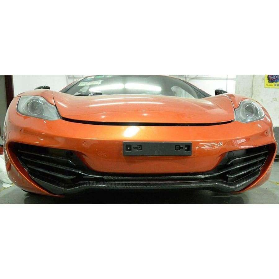 Mclaren MP4 Coupe/Convertible Carbon Fibre Front Lip Spoiler. The 12C Front Lip for the Coupe and Convertible Models has been designed using 3D Imaging to ensure we achieve the perfect fitment for your Mclaren 12C. Each part is manufactured and finished by hand to produce a stunning piece to add to any Mclaren. Giving you a unique opportunity to make your Mclaren stand apart.