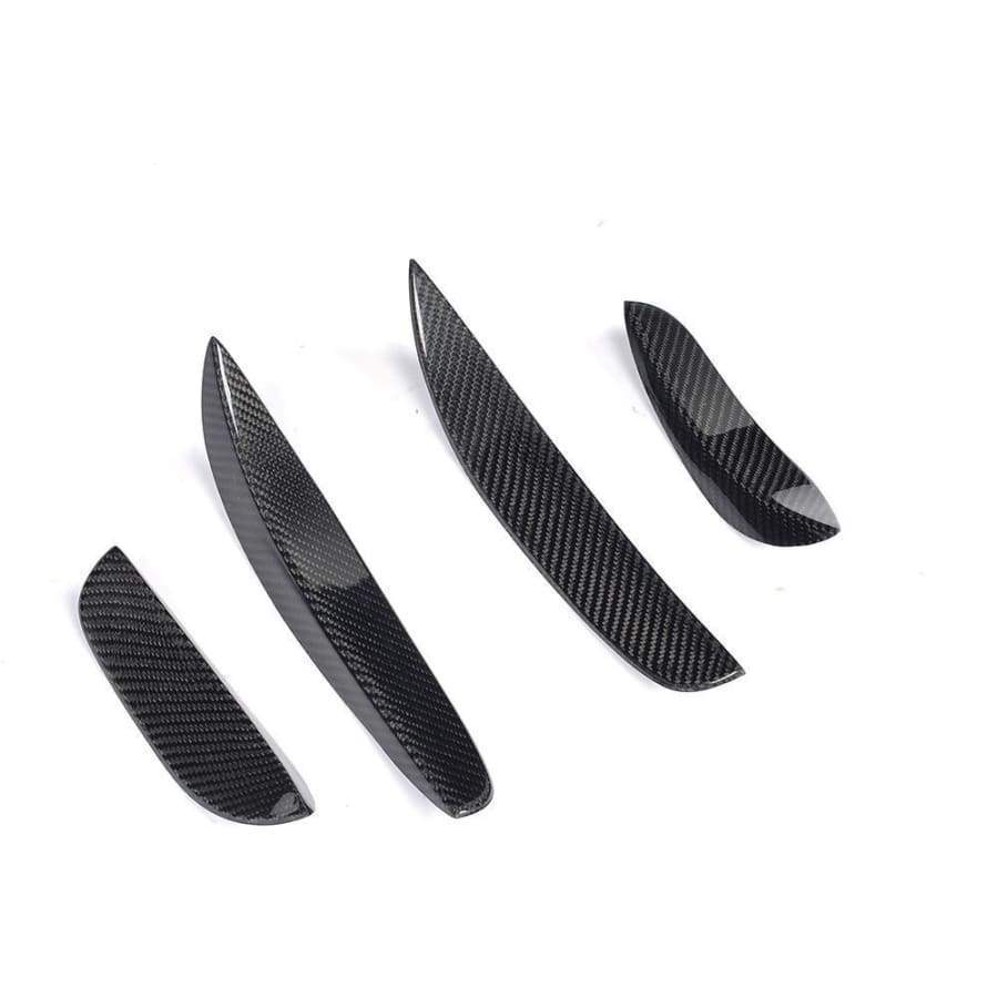 Mercedes Benz C63 Carbon Fibre Front Canards for the W205/S205/C205 and A205 C63 Models - Designed to perfectly fit the C63 Coupe/Convertible/Saloon and Estate Models. This product is manufactured from 100% 2*2 Carbon Fibre Weave that is finished in a gloss resin on the top side with a matte finish on the underside that has additional protection for road debris protection. This item is a simple way to enhance the front of your C63 Model.