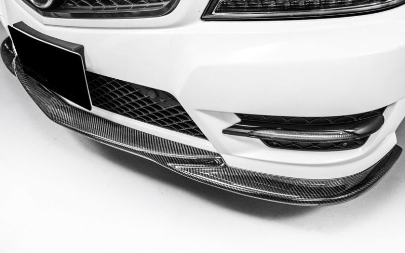 Mercedes Benz C-Class AMG Line Saloon (W204) and Estate (S204) GODHAND Style Carbon Fibre Front Lip Spoiler - Manufactured to fit 2012, 2013 and 2014 Facelift W204 C-Class Mercedes Models like the C180, C200, C230, C300. This product has been designed to perfectly accompany the OEM AMG Line front bumper and add additional benefits such as increased downforce and a more iconic styling for this model. 