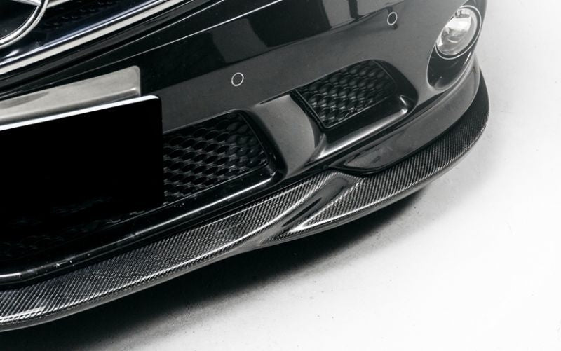 The Mercedes Benz C63 W204 Saloon S204 Estate C204 Coupe Godhand Style Carbon Fibre Front Lip Spoiler for the Pre-Facelift 2008,2009,2010, and 2011 C63 W204 Models. This product is the perfect addition to the W204 C63 AMG Mercedes, with its perfectly fitted centre formation filling the gap in the centre of the front lip to create a more unified look and style. 