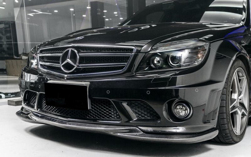 The Mercedes Benz C63 W204 Saloon S204 Estate C204 Coupe Godhand Style Carbon Fibre Front Lip Spoiler for the Pre-Facelift 2008,2009,2010, and 2011 C63 W204 Models. This product is the perfect addition to the W204 C63 AMG Mercedes, with its perfectly fitted centre formation filling the gap in the centre of the front lip to create a more unified look and style. 