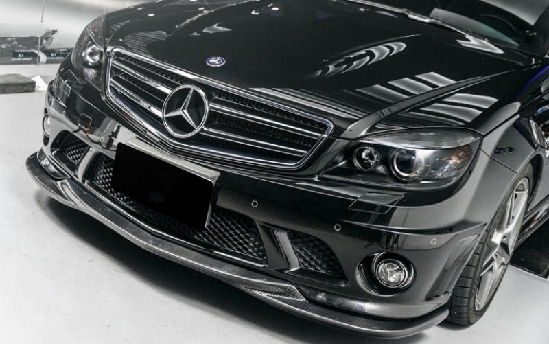 The Mercedes Benz C63 W204 Saloon S204 Estate C204 Coupe Godhand Style Carbon Fibre Front Lip Spoiler for the Pre-Facelift 2008,2009,2010, and 2011 C63 W204 Models. This product is the perfect addition to the W204 C63 AMG Mercedes, with its perfectly fitted centre formation filling the gap in the centre of the front lip to create a more unified look and style. 