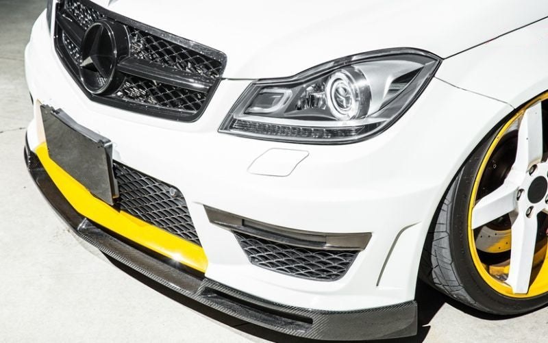 Mercedes Benz C63 W204 Saloon and S204 Estate VS Style Carbon Fibre Front Lip Spoiler for the Facelift C63 Models - Manufactured From 2*2 Carbon Fibre Weave to create a stunning front lip spoiler for the W204 and S204 C63 Models. This product has a vented design with separate vents on each bumper corner and a lower vent in the centre, giving it the Unique VS Styling.