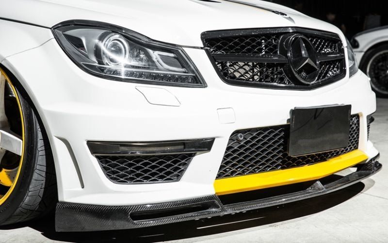 Mercedes Benz C63 W204 Saloon and S204 Estate VS Style Carbon Fibre Front Lip Spoiler for the Facelift C63 Models - Manufactured From 2*2 Carbon Fibre Weave to create a stunning front lip spoiler for the W204 and S204 C63 Models. This product has a vented design with separate vents on each bumper corner and a lower vent in the centre, giving it the Unique VS Styling.