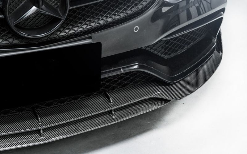 Mercedes W205/C205/A205 C63 Brabus Style Carbon Fibre Front Lip Spoiler - Inspired by the masters of Mercedes tuning with its larger presence on the upswept bumper side extensions, this product is for those Mercedes enthusiasts that want performance as well as style for their C63 Mercedes.