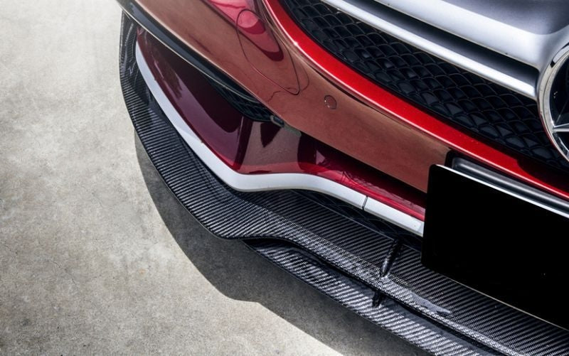 Mercedes W205/C205/A205 C63 Brabus Style Carbon Fibre Front Lip Spoiler - Inspired by the masters of Mercedes tuning with its larger presence on the upswept bumper side extensions, this product is for those Mercedes enthusiasts that want performance as well as style for their C63 Mercedes.