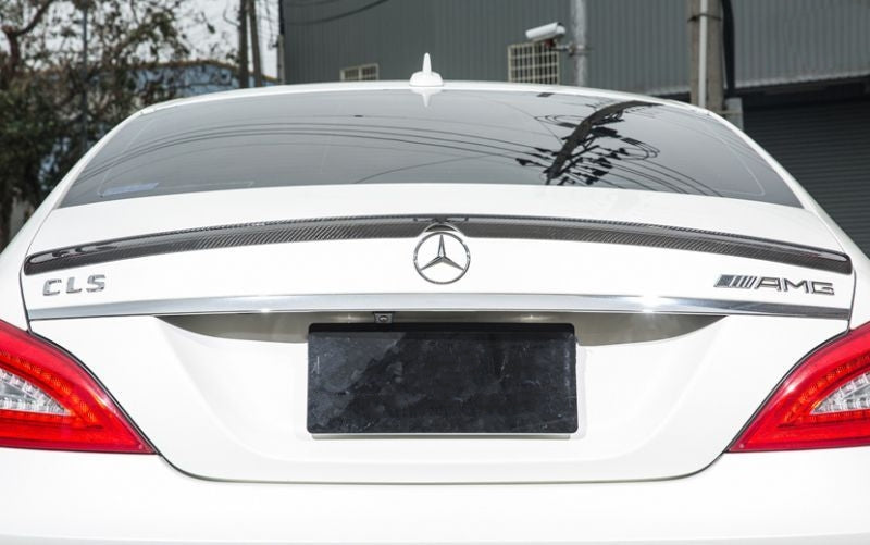 Mercedes Benz CLS-Class and CLS63 (W218) AMG Style Carbon Fibre Rear Trunk Spoiler - Manufactured from 2*2 Carbon Fibre Weave, this AMG Style Carbon Spoiler adds a touch of sophistication to the CLS Class and CLS63 Models with the Perfect fitment that has the centre notch for placement around the original rear badge. This product enhances the rear of your CLS Class with Style.