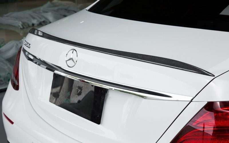 Mercedes Benz E-Class/E43/E63 Saloon (W213) AMG Style Carbon Fibre Rear Trunk Lip Spoiler - Manufactured from 2*2 carbon fibre Weave. Inspired by the OEM AMG Styling for the E-Class Models, this spoiler adds a touch of elegance to the E-Class Models with a small addition to the rear end that accents the body lines and adds texture. 