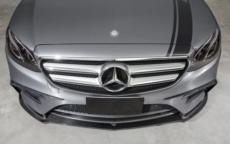Mercedes Benz E-Class/E43 Saloon (W213) and Estate (S213) Pre-Facelift Future Design Style Carbon Fibre Front Lip Spoiler - Manufactured from 2*2 Carbon Fibre weave in the Future Design Styling with a centre point of contact design that enables air to pass through creating a downforce effect on the underside of the E-Class Model. This front lip spoiler is a Unique part for the E-Class Mercedes.