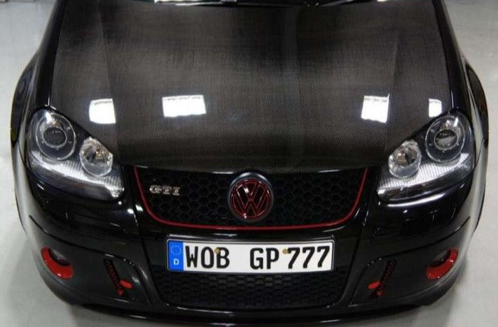 Enhance the style and performance of your Volkswagen Golf Mk5 with a high-quality carbon fibre hood. Designed to fit the Golf Mk5 SE, GTI, GTD, and R32 models, this hood improves aerodynamics and adds a sleek, sporty look to your car. UV-resistant gloss resin coating and corrosion-resistant construction ensure long-lasting durability. Upgrade your Golf Mk5 with a premium carbon fibre hood today.